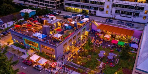 An aerial image of a rooftop restaurant with a large gathering of people in Tacoma